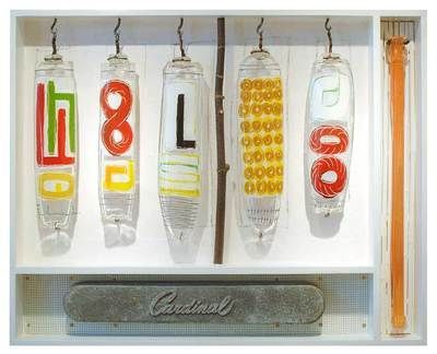 Five glass cylinders spelling 