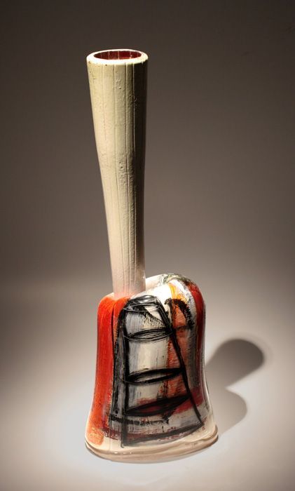 Ceramic vase with a tall, slender neck and a bulbous, painted base in red, white, and black.