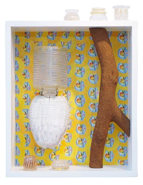 White box with various pieces of art.