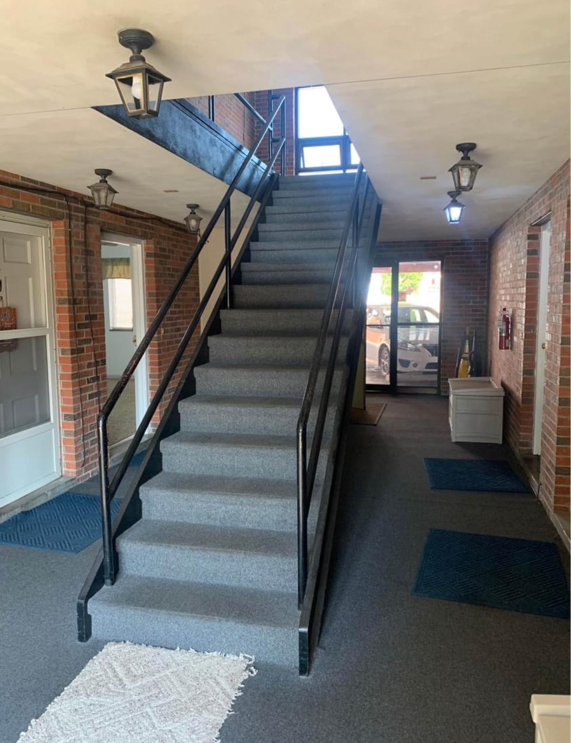 A set of stairs leading up to the second floor of a building