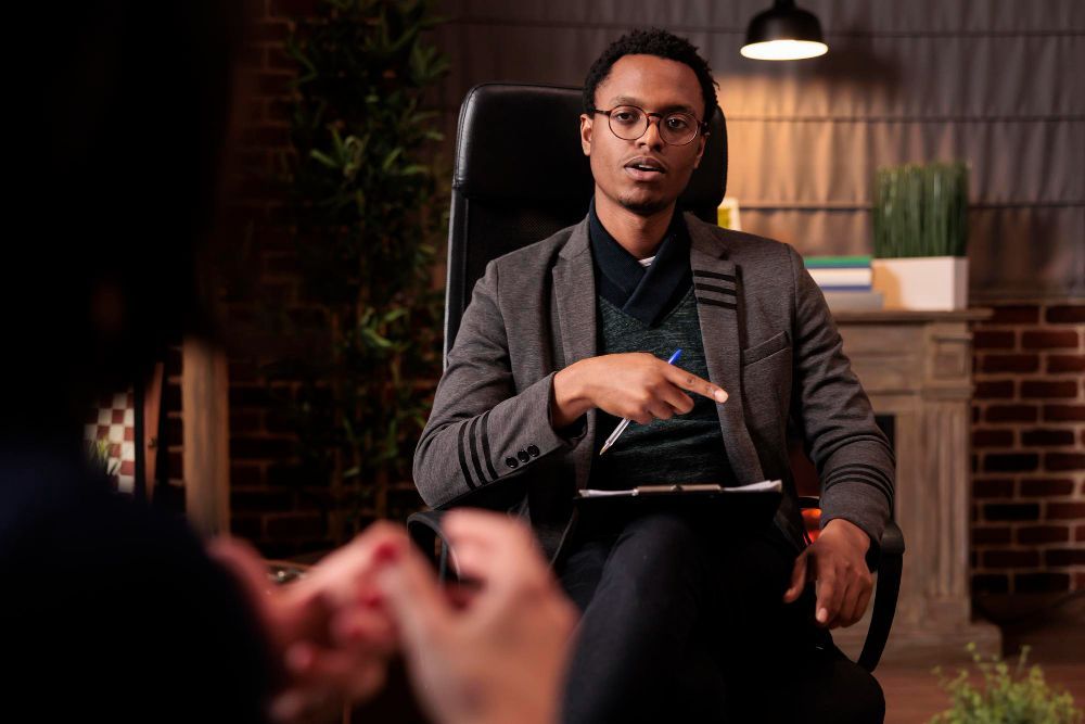 Black man in formal clothes, talking 