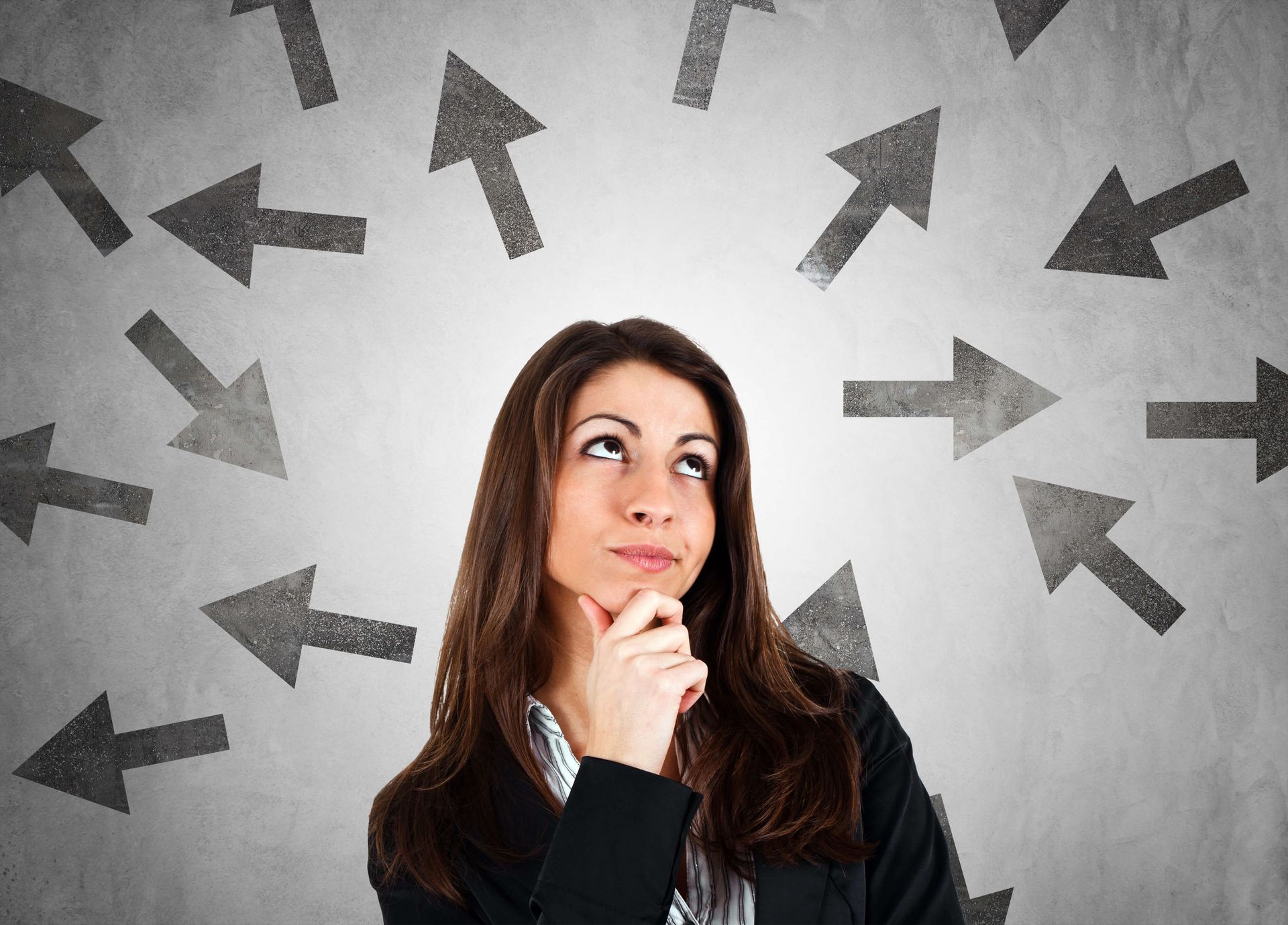 A woman with a thoughtful expression, surrounded by arrows pointing in various directions, representing the processing of complex thoughts or memories in therapy.