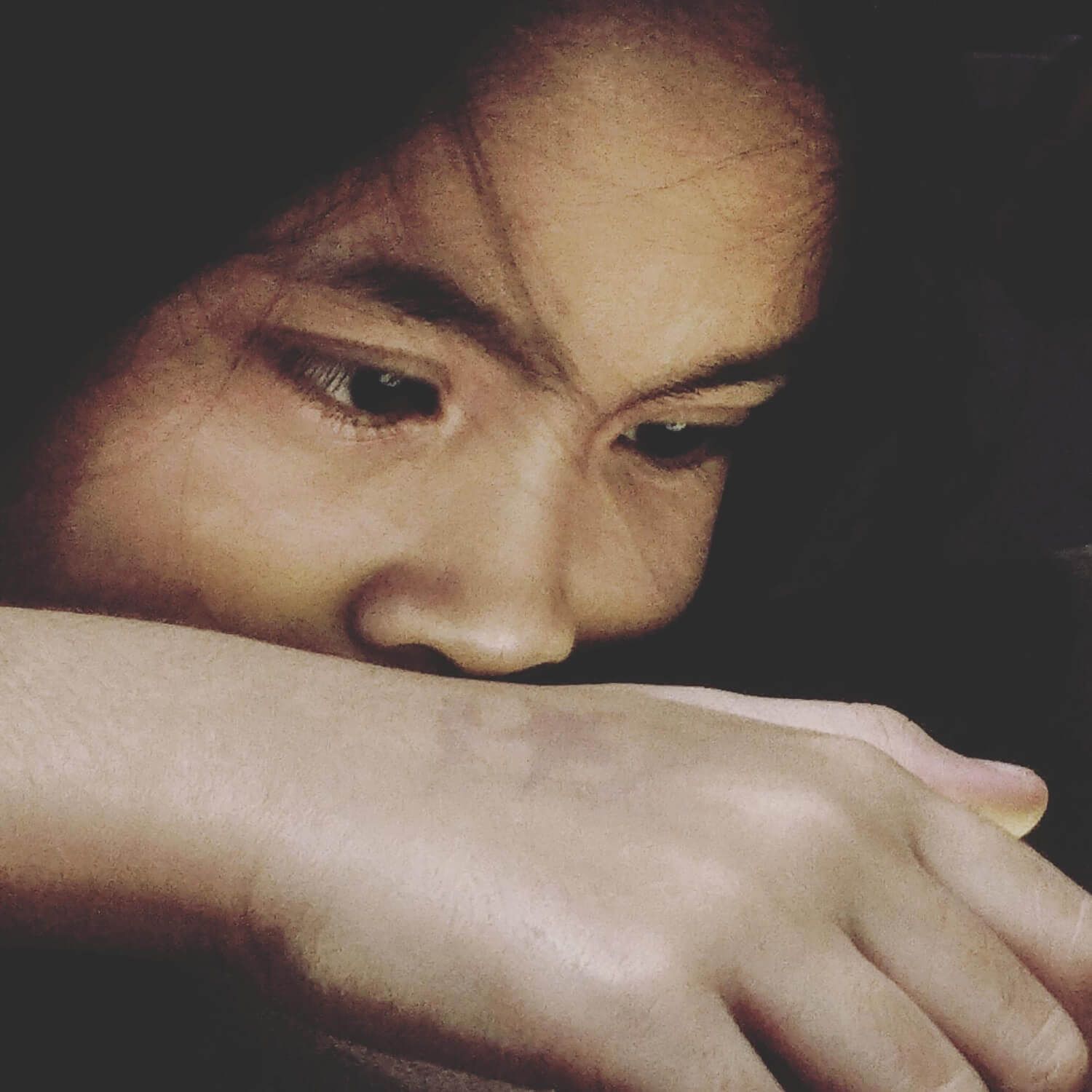 Unlike traditional PTSD from single incidents, complex PTSD develops from prolonged, repeated trauma that often occurs during critical developmental periods. Woman with hand covering face showing distress and emotional pain associated with complex PTSD and developmental trauma