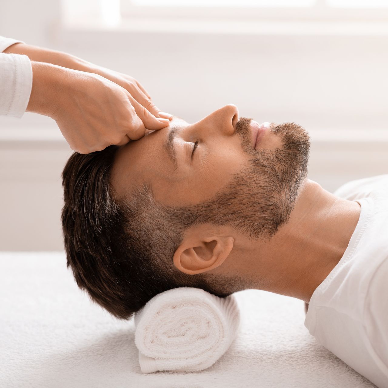 bearded man having relaxing head massage