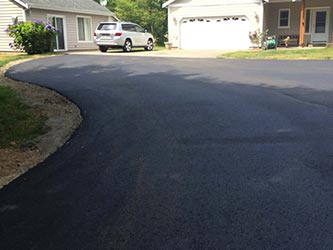 Driveway After Asphalt - Repaired Curved Asphalt Road in Kent, WA