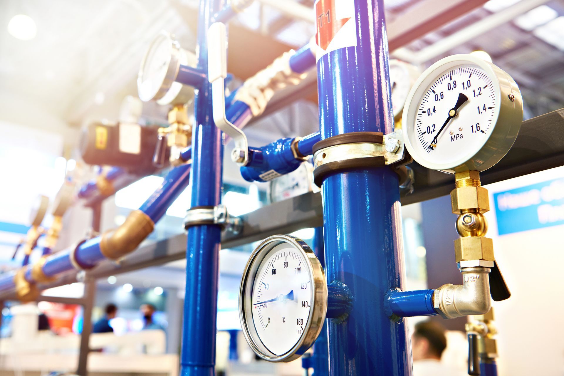 Blue pipes with pressure gauges.