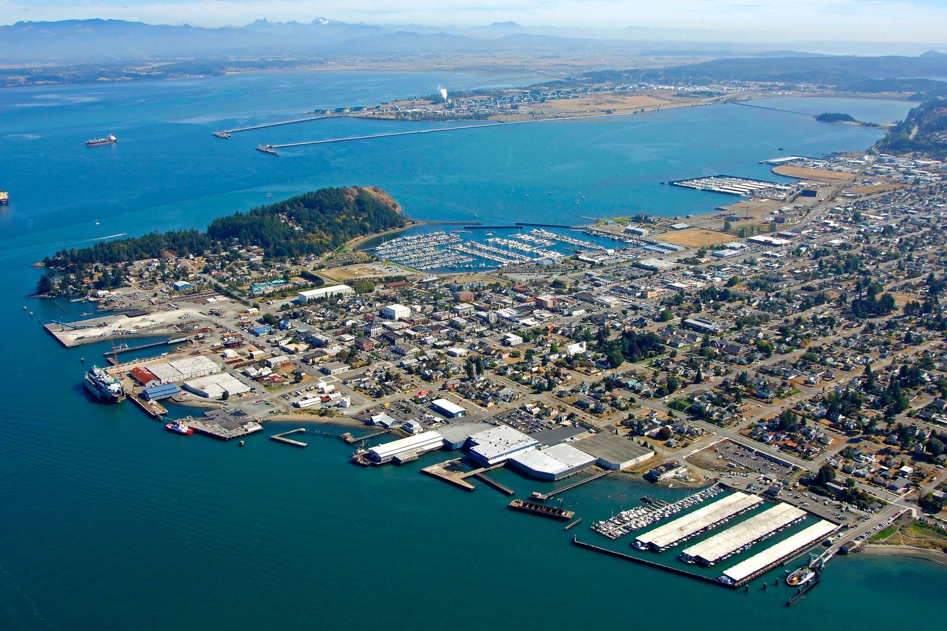 An aerial view of a city surrounded by water