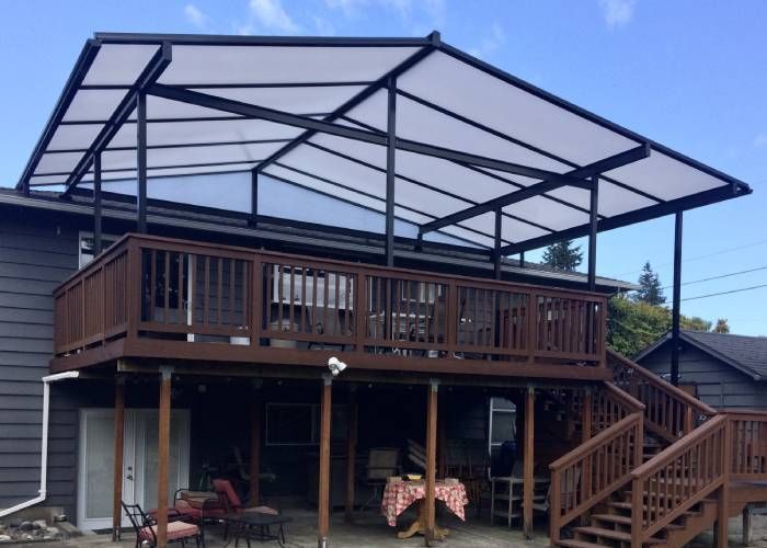 A house with a large deck and stairs