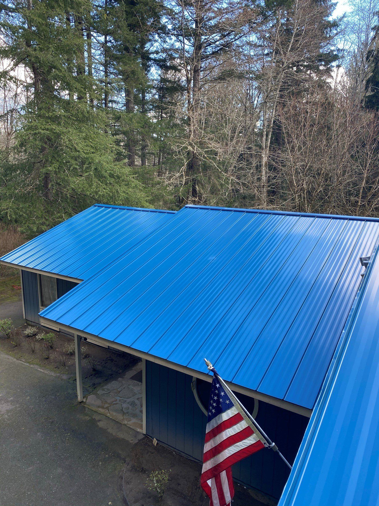 A blue roof with an american flag on it.