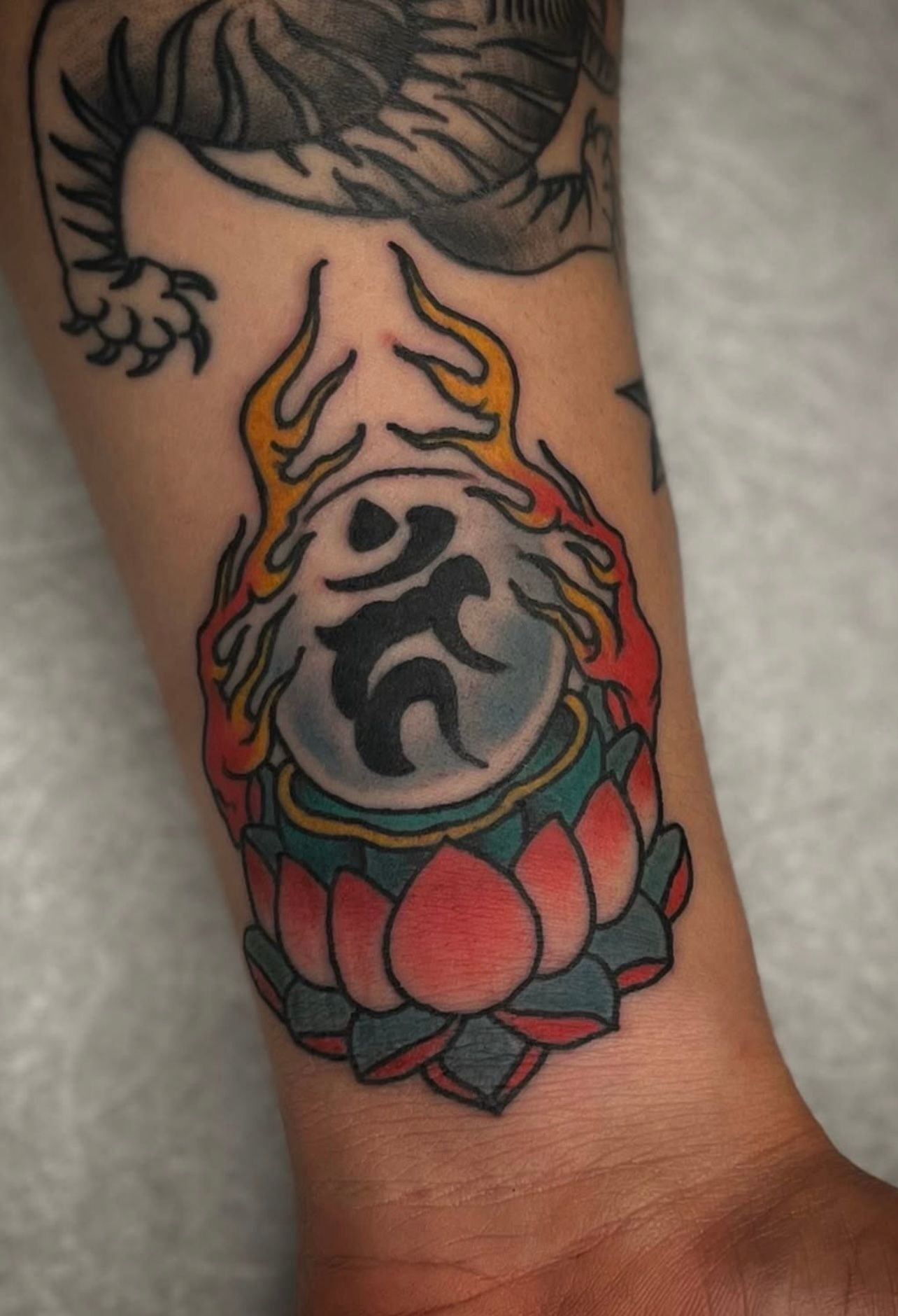 Traditional-lotus-ohm-tattoo-best-tattoo-shop-Wahiawa-flash-tattoo-walk-in-tattoo-shop-near-me-Wahiawa-American-made-tattoo