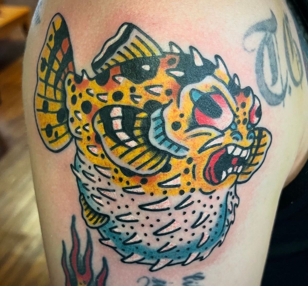 puffer fish tattoo by American Made Tattoo