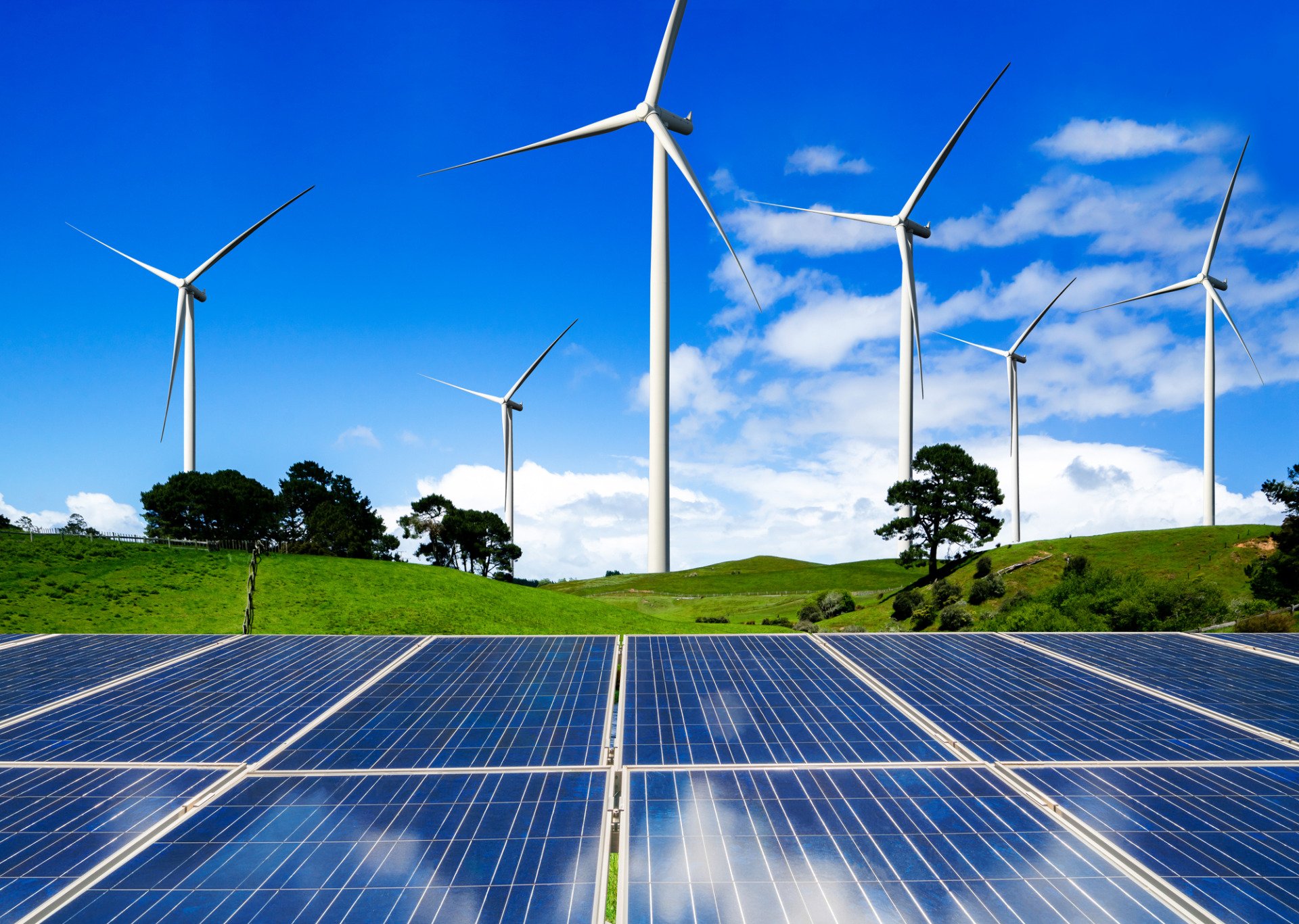 wind turbines overlooking solar panels