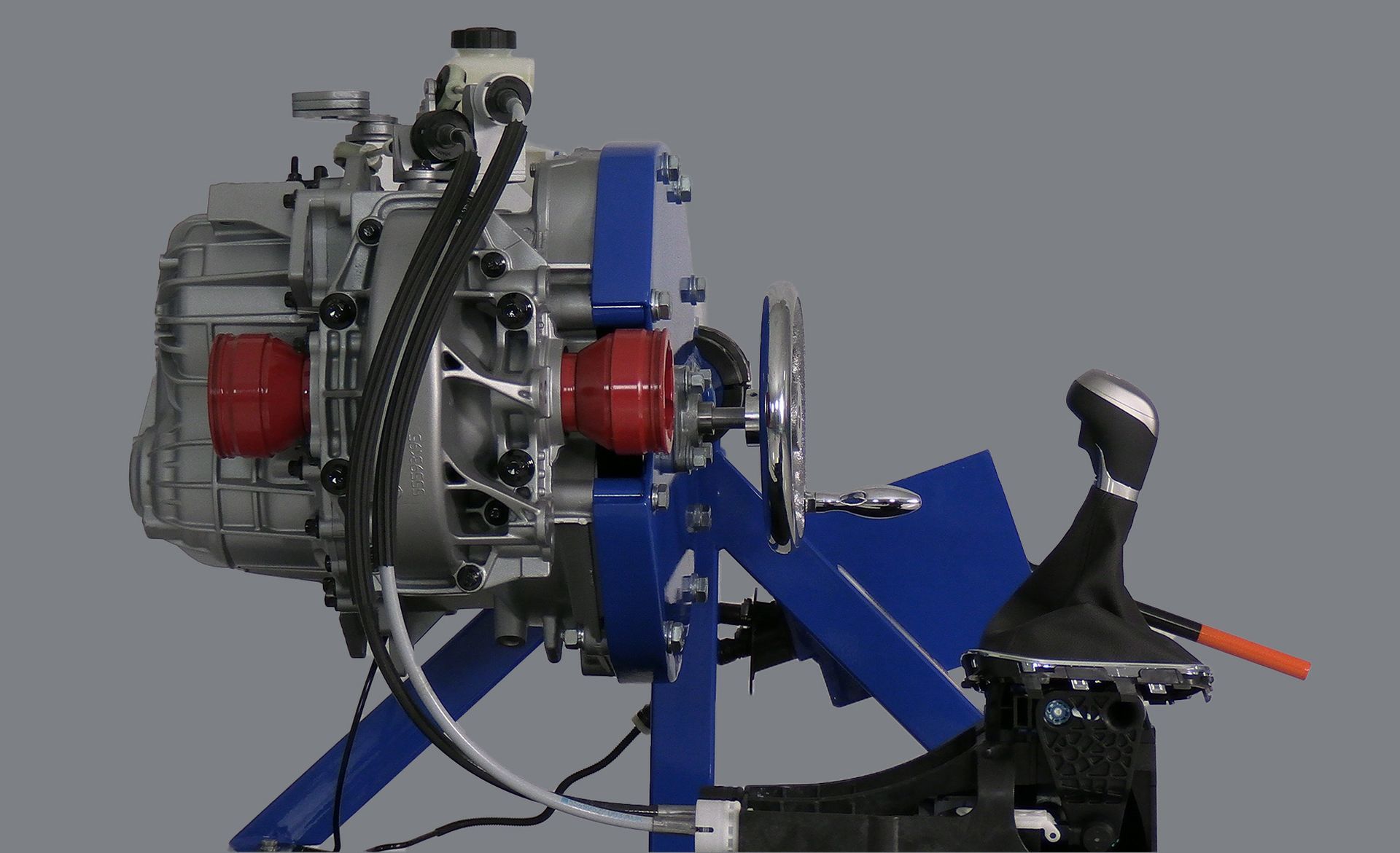 A close up of a blue and silver engine on a stand