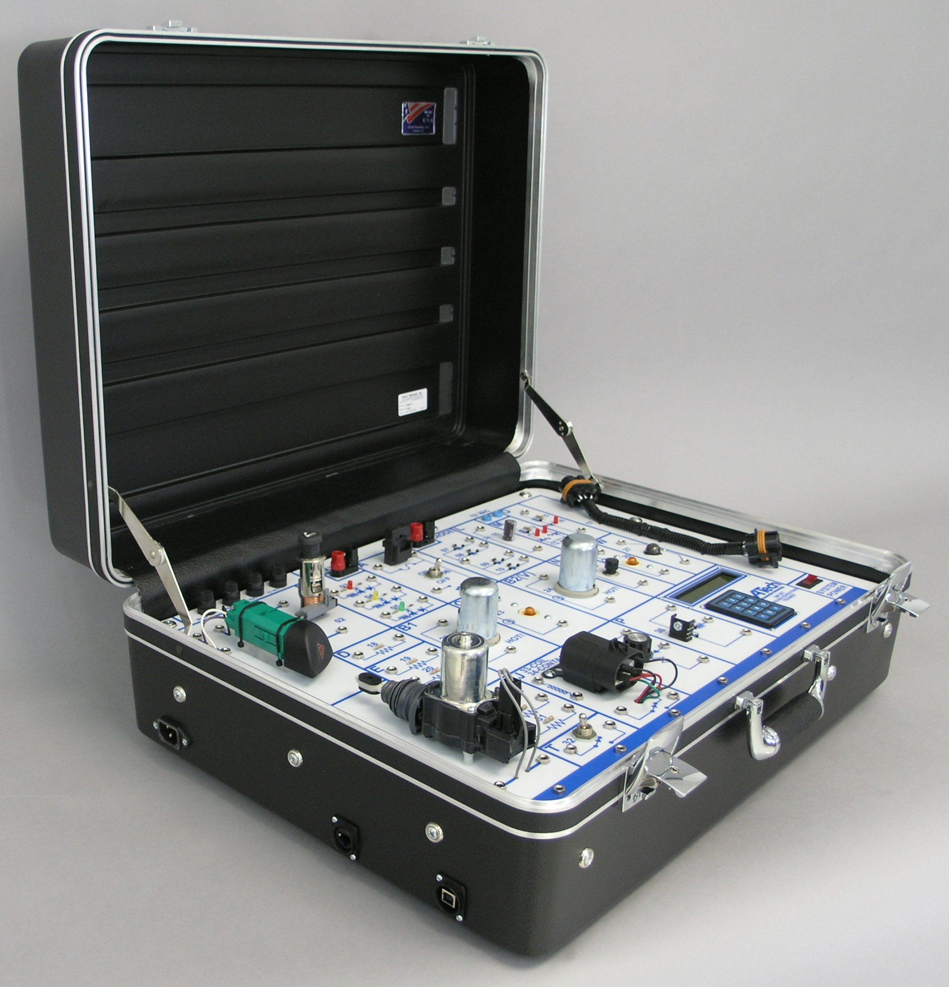 A briefcase with a bunch of electronics inside of it