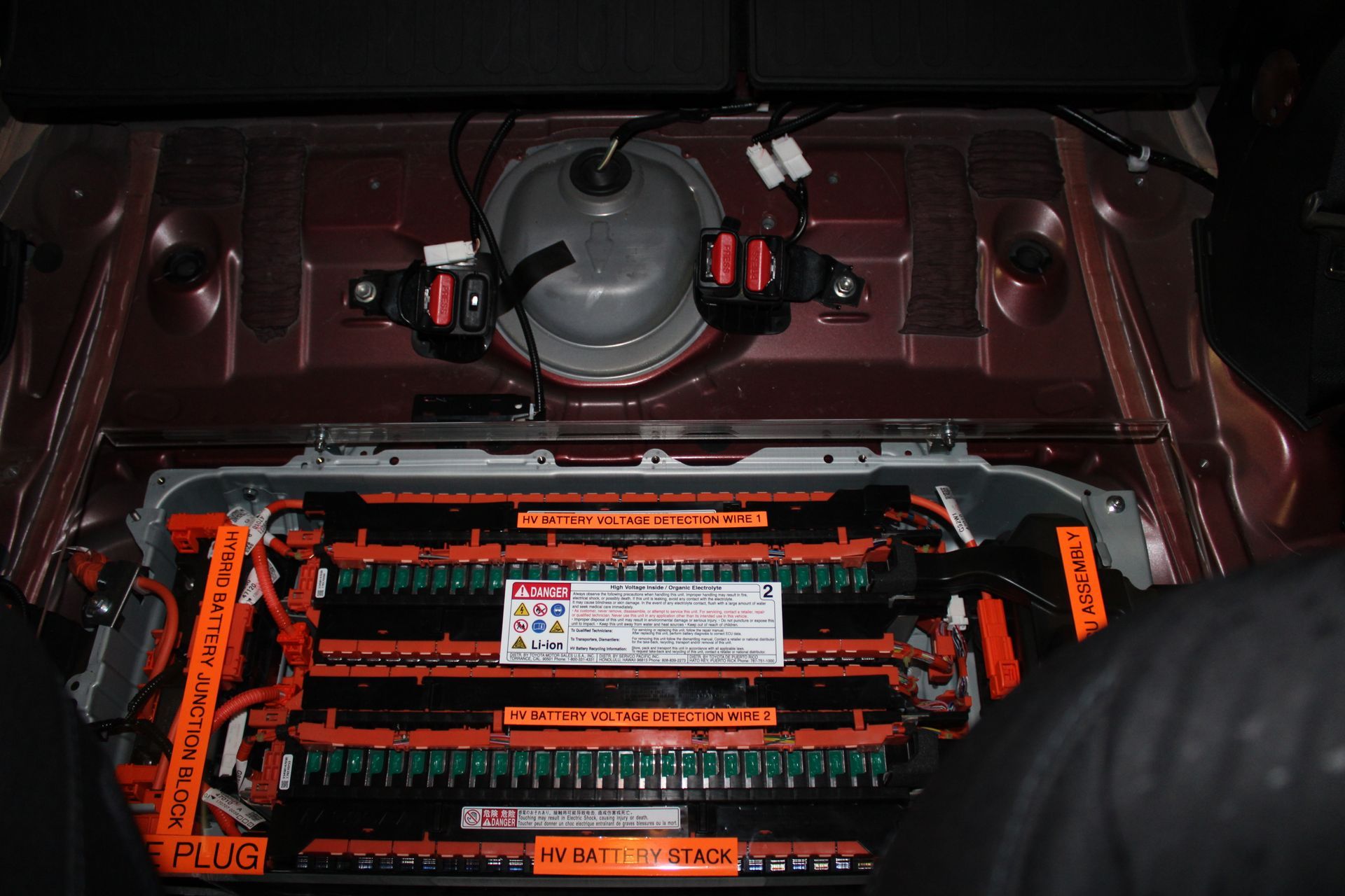 A close up of a car battery with the word plug on it