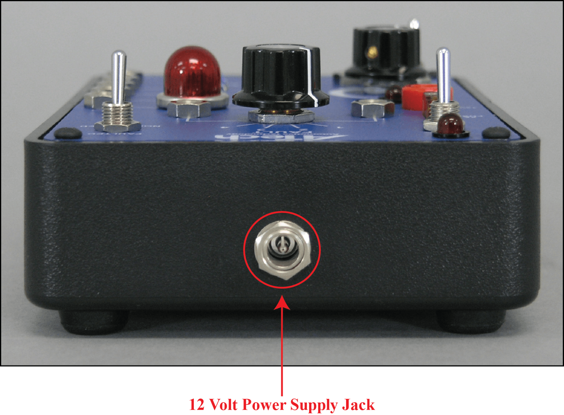 A 12 volt power supply jack is shown on the side of a device