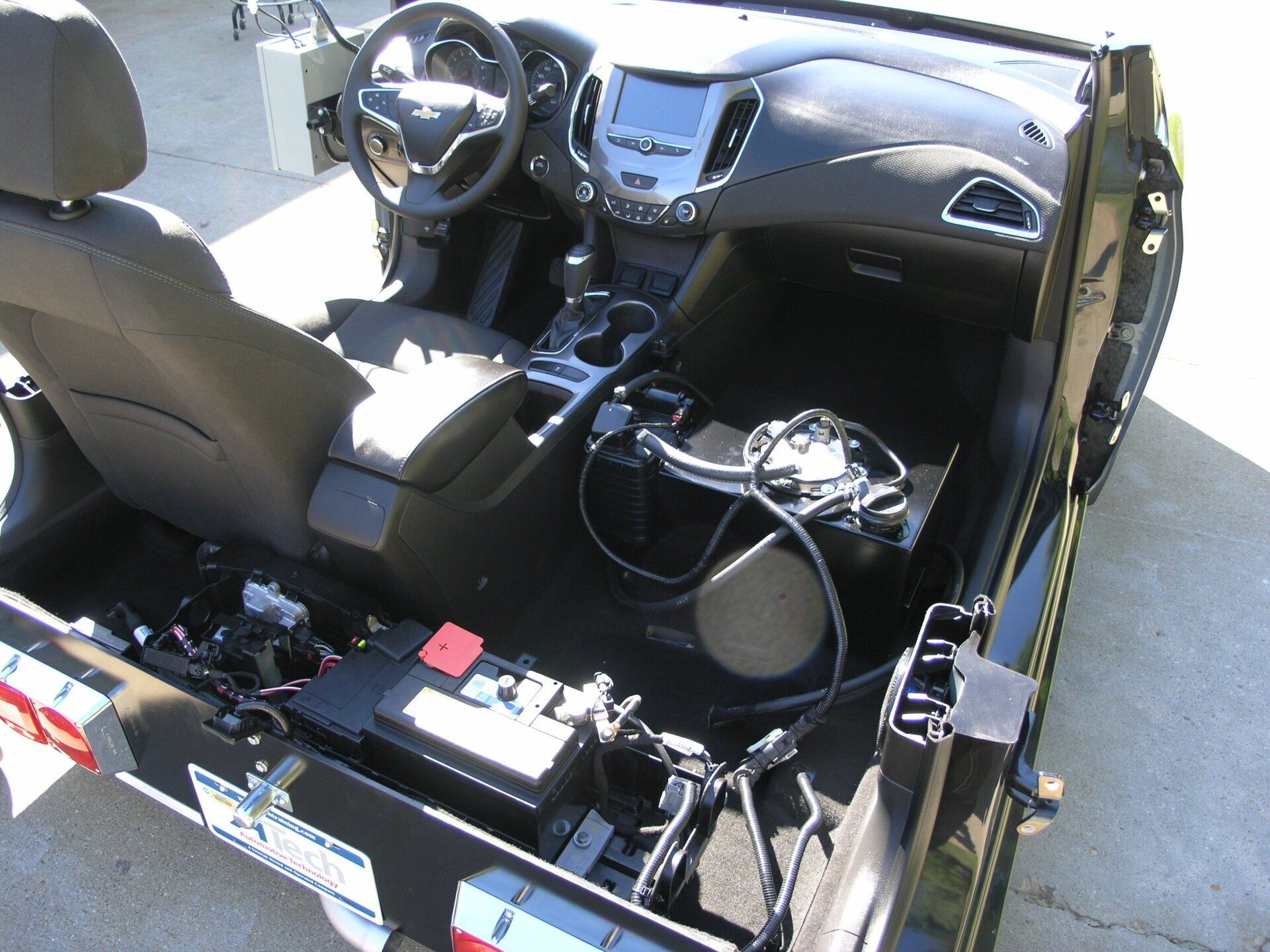 The inside of a car with a license plate that says california