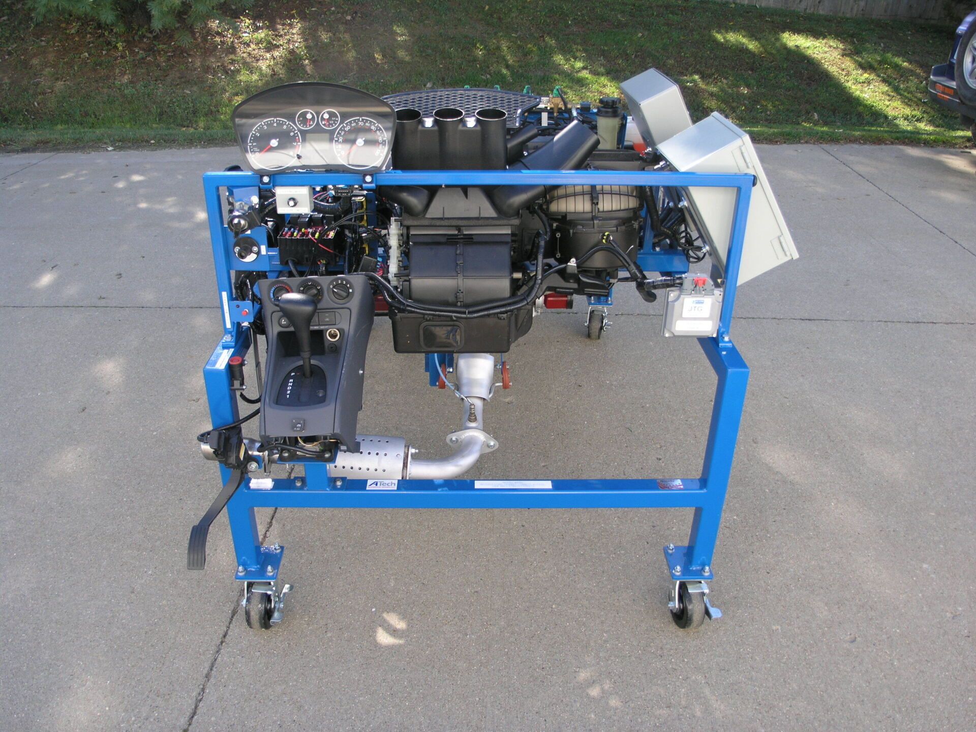 A blue stand with a bunch of parts on it