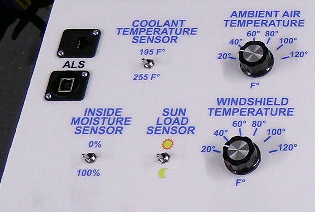 A close up of a coolant temperature sensor and ambient air temperature sensor