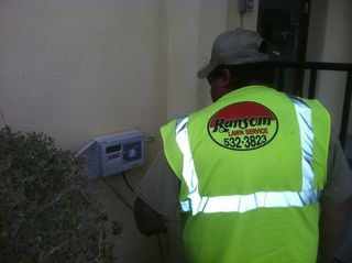 Irrigation Repair — Ranson Lawn Service Employee Wearing a Safety Vest in El Paso, TX