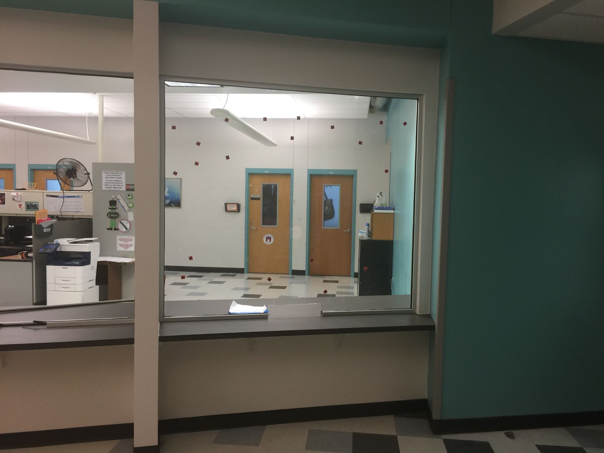 A view of a room through a window in a building