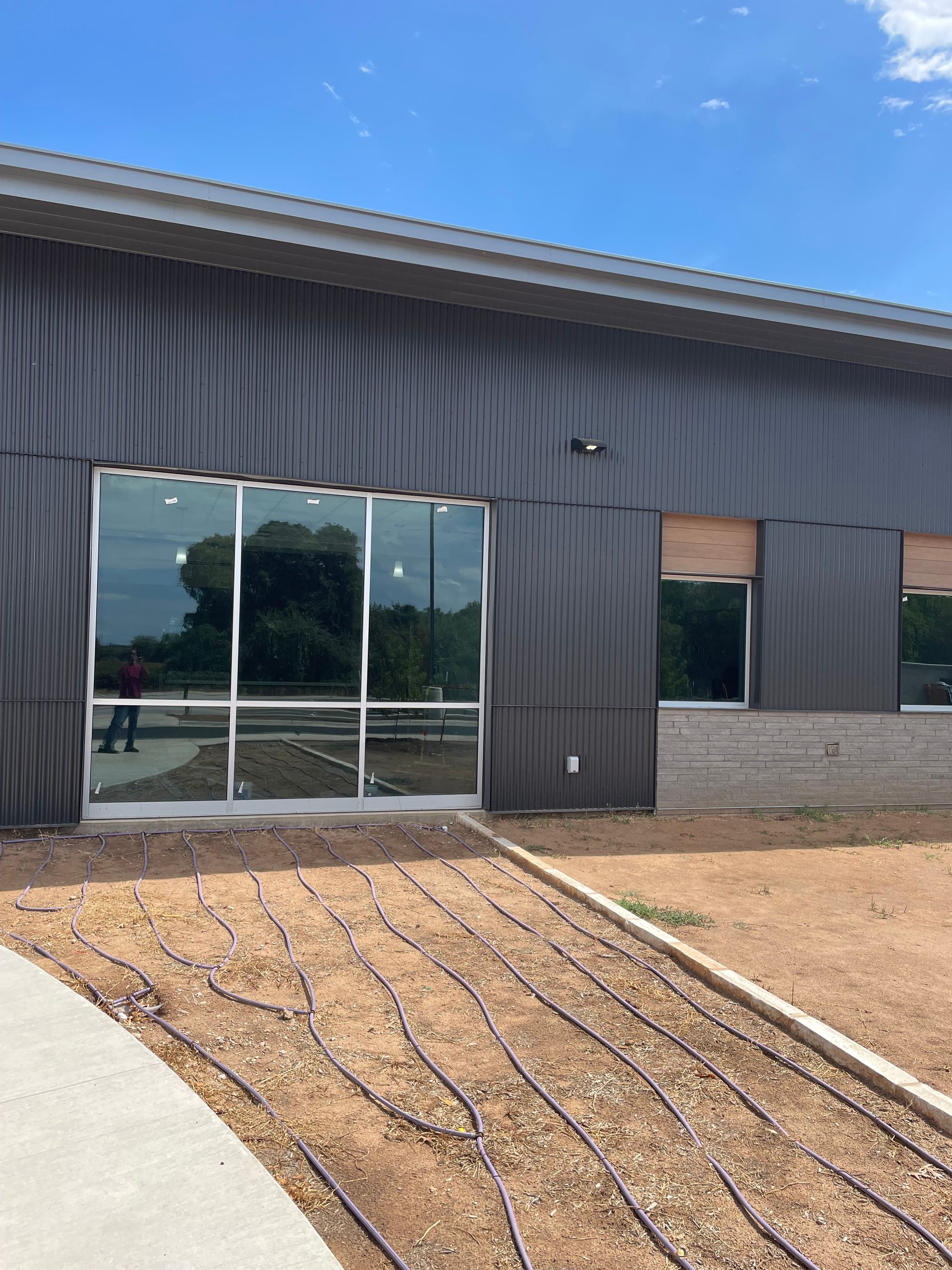 A large building with a lot of windows is being built