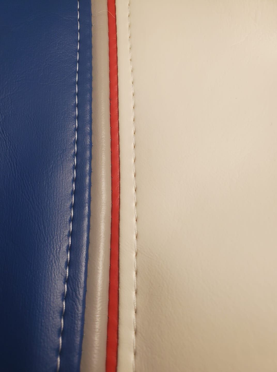 Blue, white, and red striped leather upholstery.