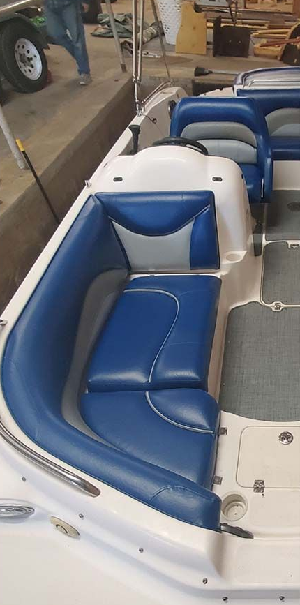 Boat interior before and after upholstery cleaning and replacement. Showing white, blue, and tan.