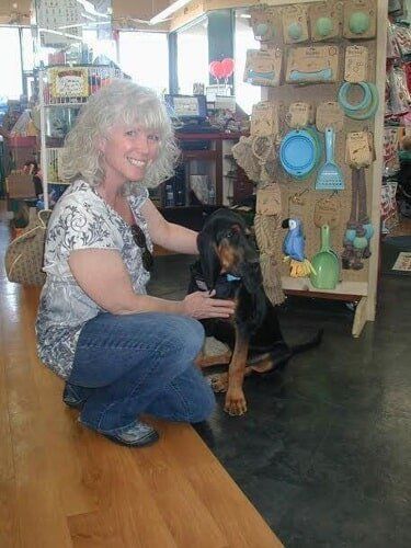 Woman with Her Black Dog — Salinas, CA — Pet Fun At Harden Ranch Plaza