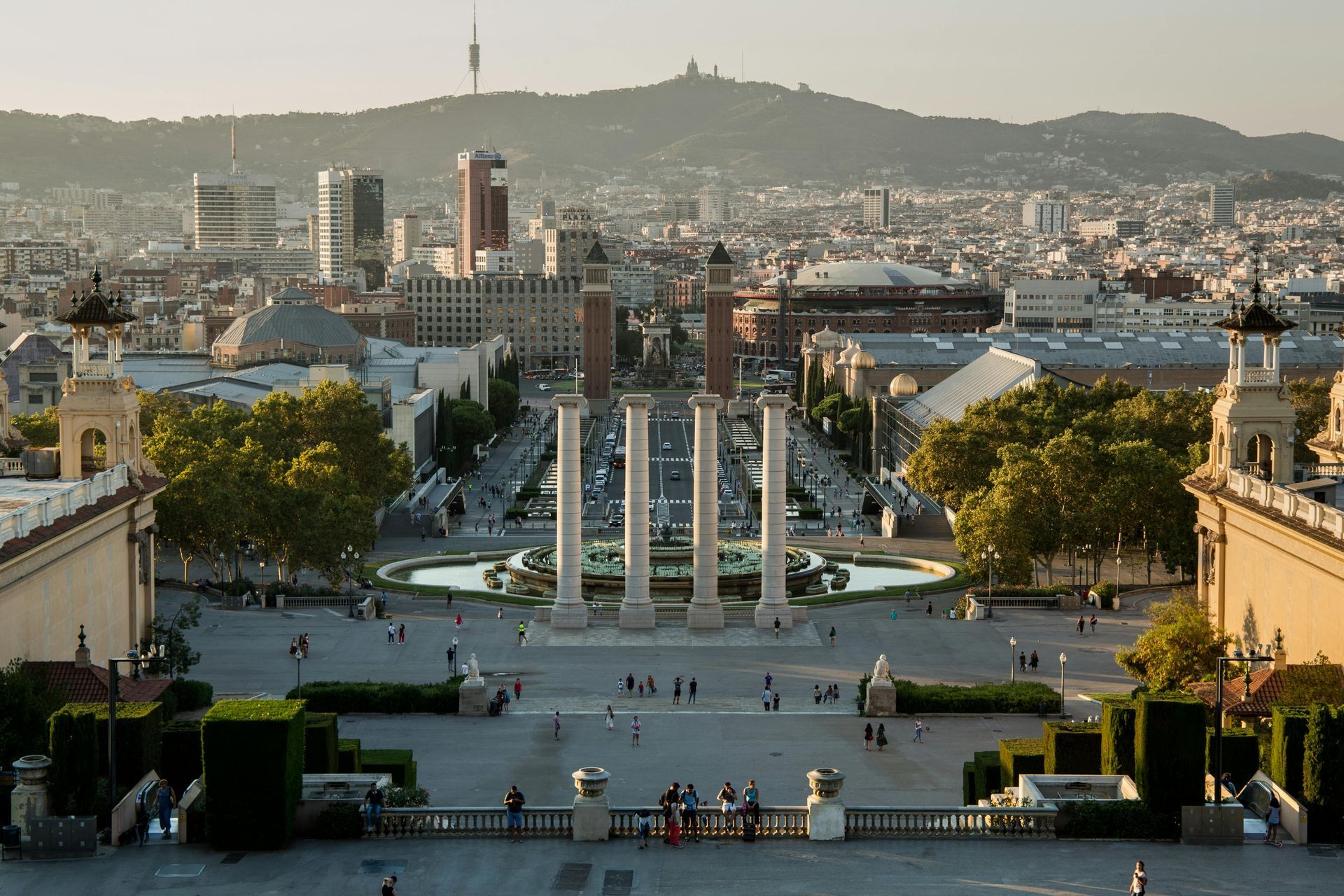An aerial view of a city with a mountain in the background.