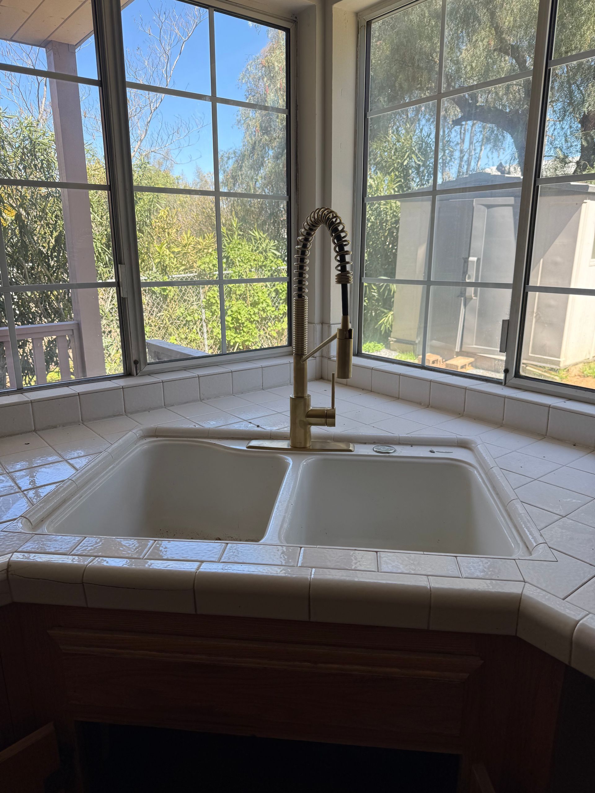 A before and after picture of a door mat on the side of a house.