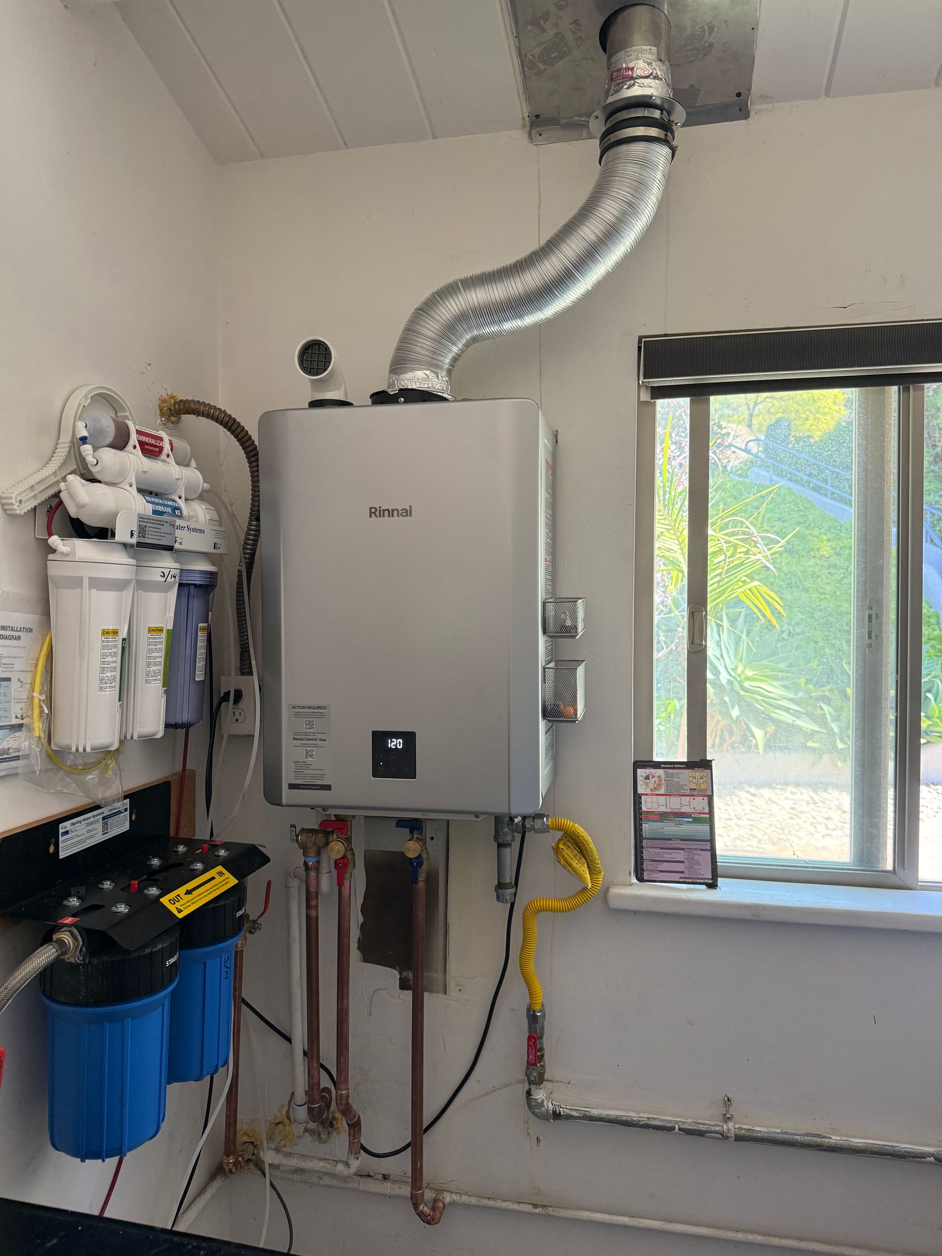 Air conditioning units with toolbox and gloves in backyard.