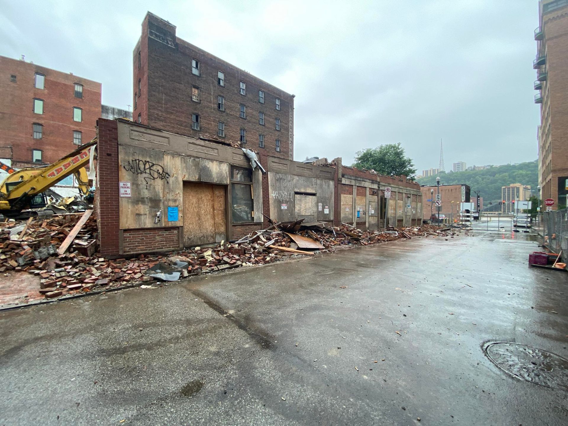 a row of abandoned buildings being demolished