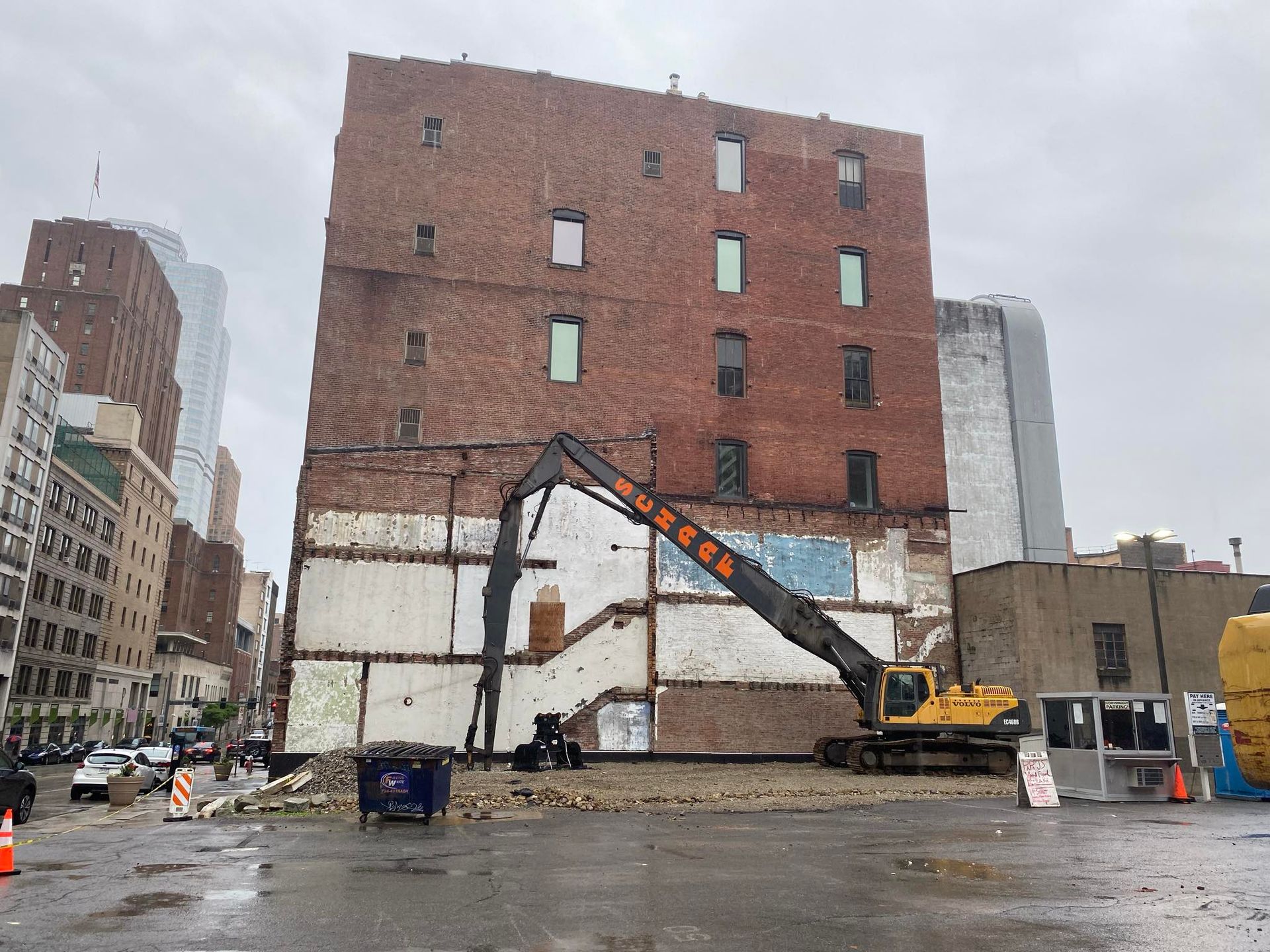 large high reach excavator parked outside job.
