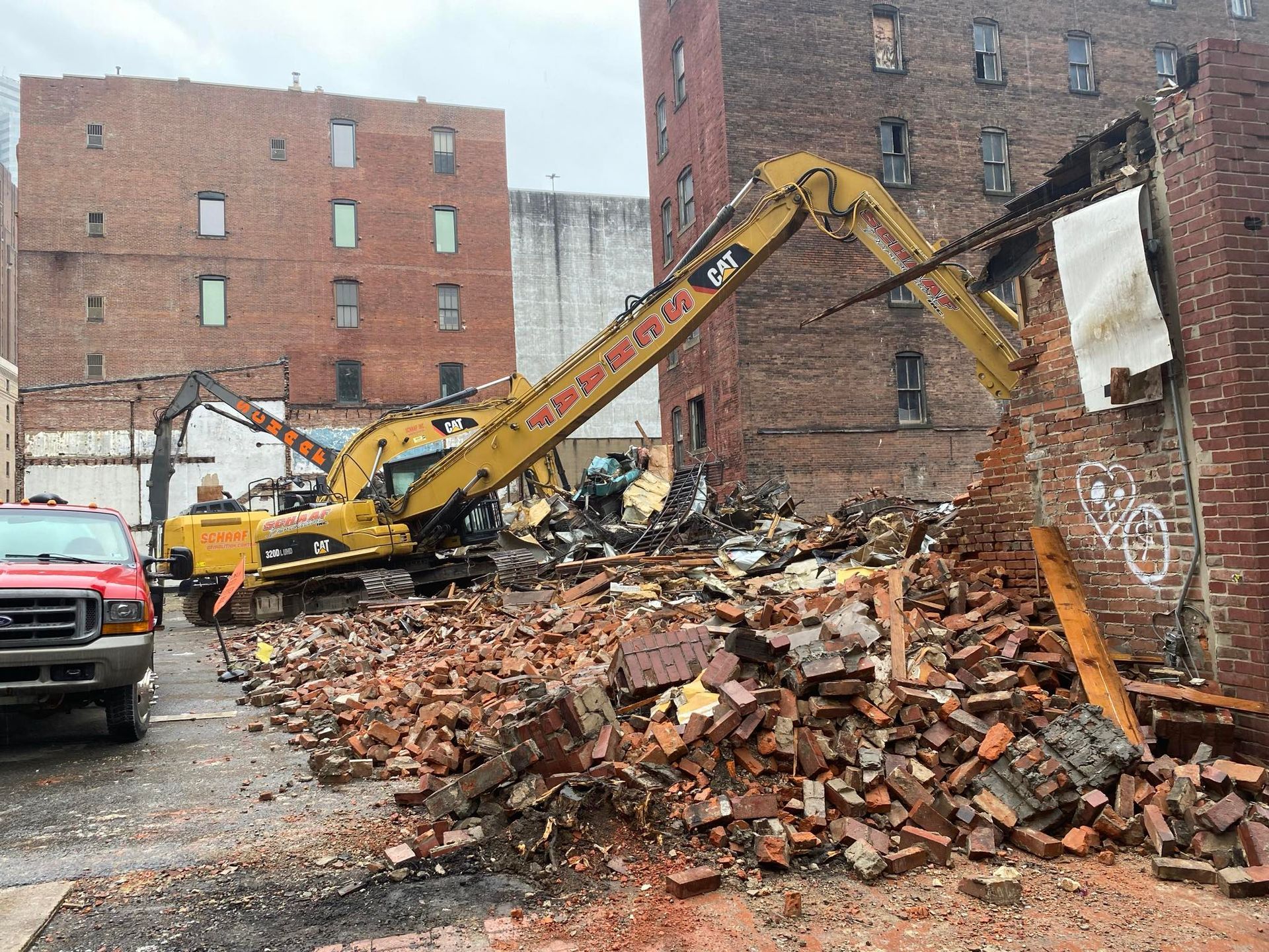 long reach excavator demolishing a building on boulevard of the allies in pittsburgh