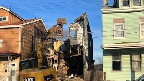 dilapidated home being torn down