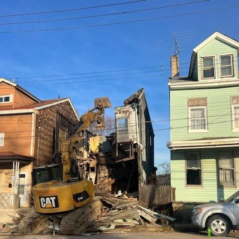 residential demolition example in between two houses