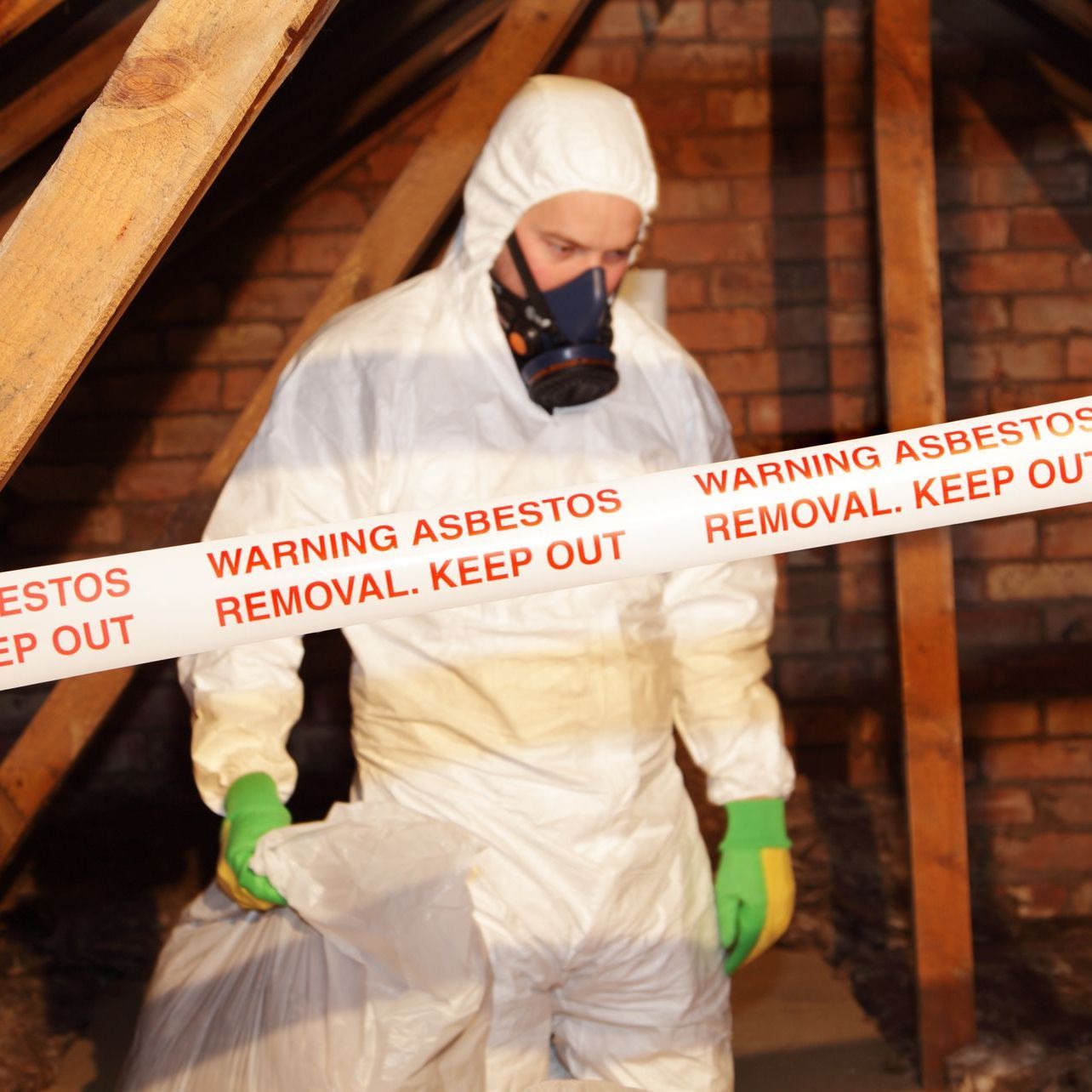 man removing asbestos