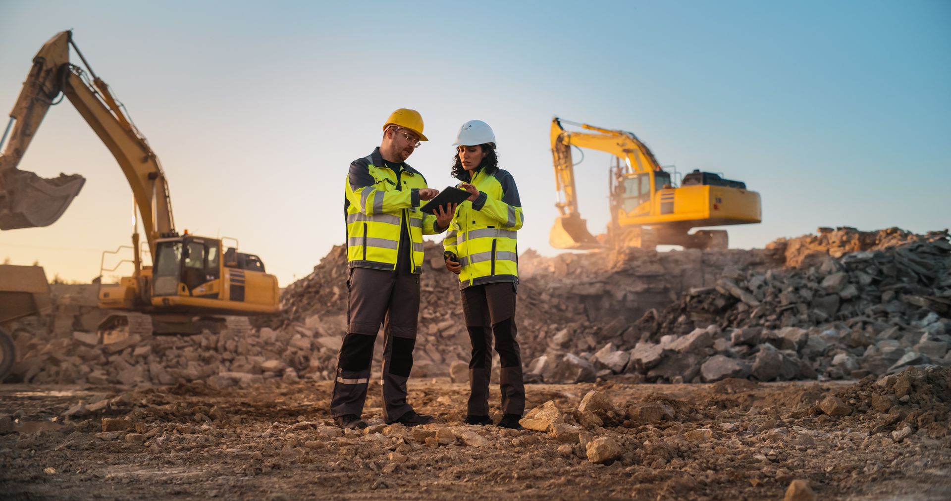 demolition workers reviewing the site after demolition