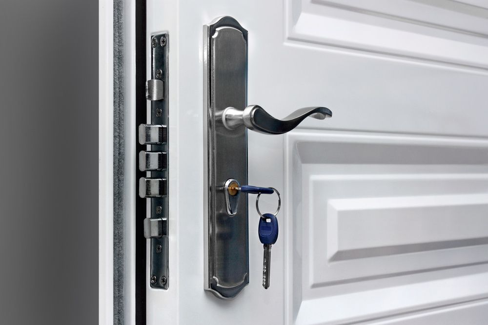 Close-up Of The Lock With Your Keys On An Armored Door — Hardware & Door Locks in Mackay, QLD
