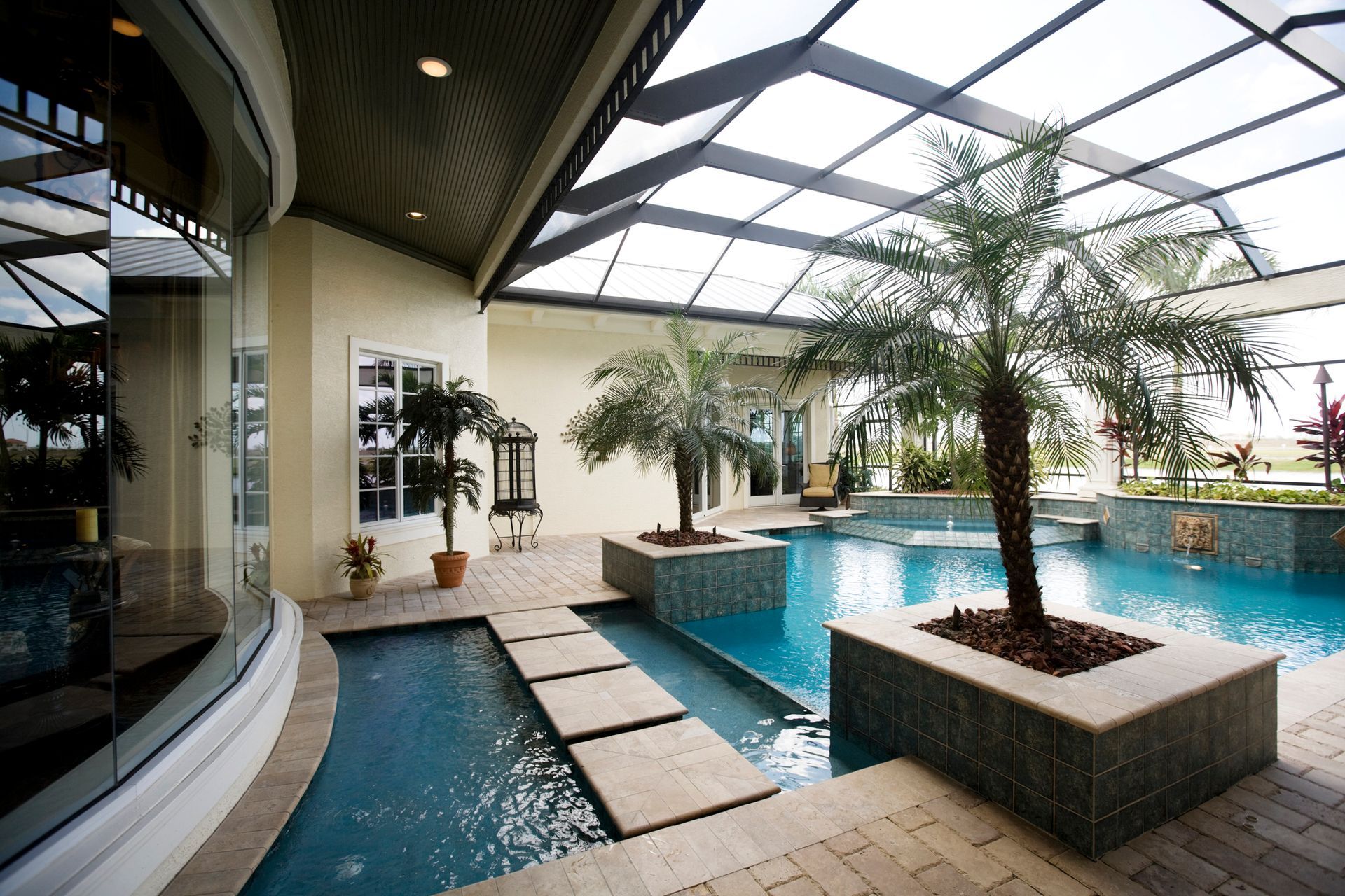 A Large Indoor Swimming Pool With A Clear Roof - Flagler County, FL - Screen Windows Painting Services