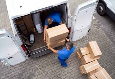 The mandurah removalist team loading packing boxes into the truck