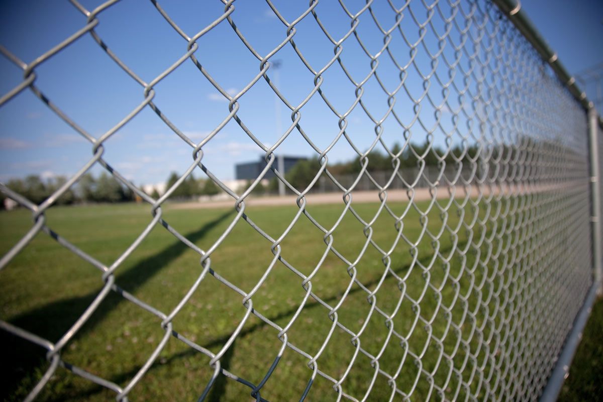 Chainlink fence on the side of a field — Beaumont, TX — A-1 Maida Fence Company