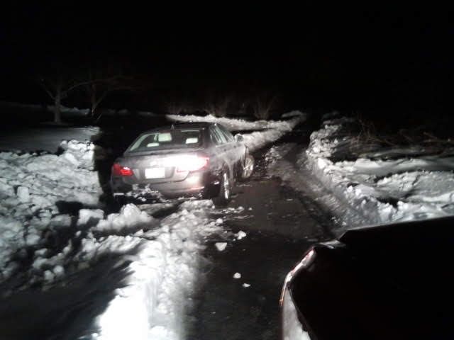 Car is Being Towed by Truck