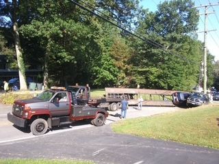 Car is Being Towed by Truck