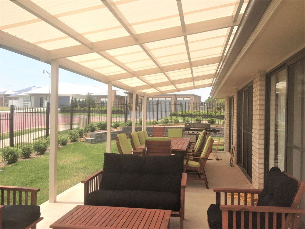 A Patio With a Table and Chairs Under a Canopy — Outdoor Leisure Living In Tuggerah, NSW