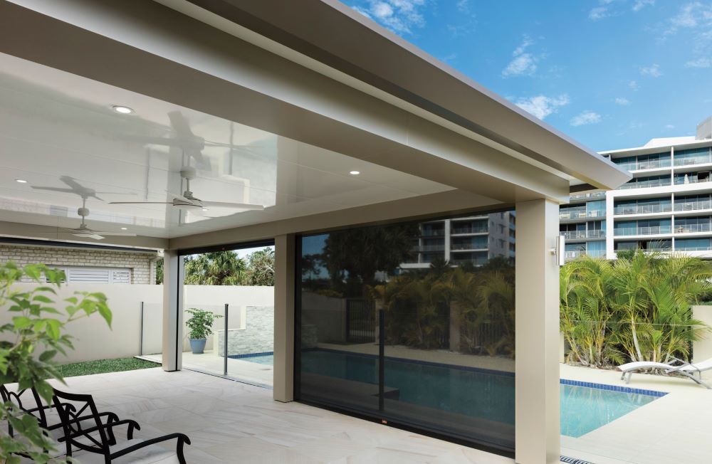 A Patio With a Swimming Pool in the Background — Outdoor Leisure Living In Tuggerah, NSW