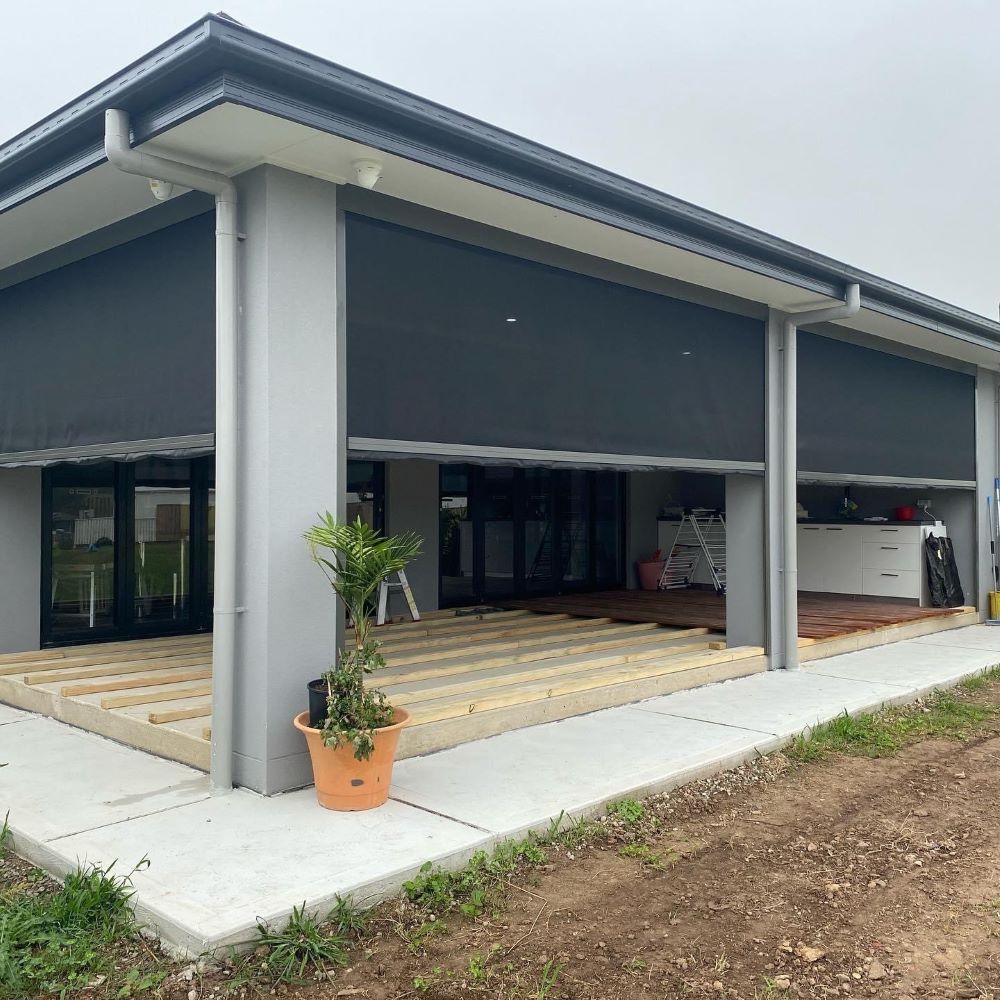 A House With a Potted Plant in Front of It — Outdoor Leisure Living In Tuggerah, NSW