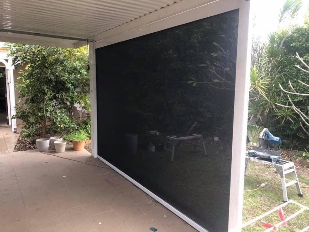 There is a Large Screen on the Side of a Building — Outdoor Leisure Living In Tuggerah, NSW