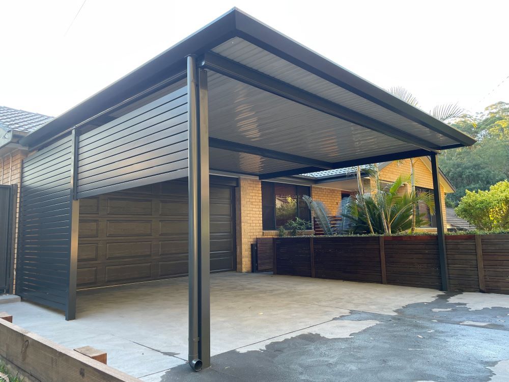A Carport is Attached to the Side of a House — Outdoor Leisure Living In Tuggerah, NSW